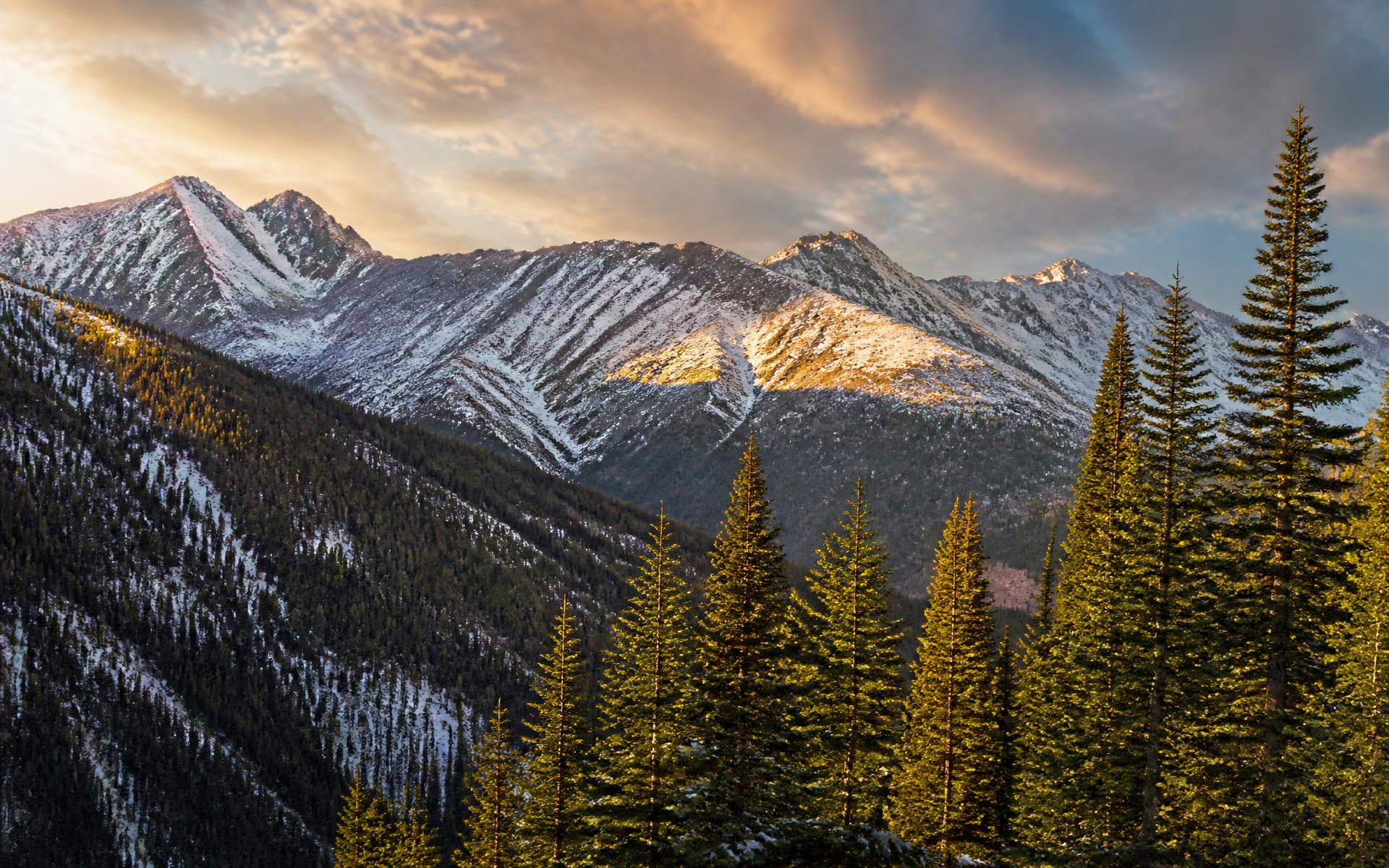 Snow-covered mountains of Taos Ski Valley at golden hour